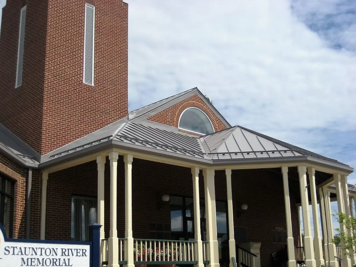 Skilled roofing craftsmen working on a residential roof in Town North